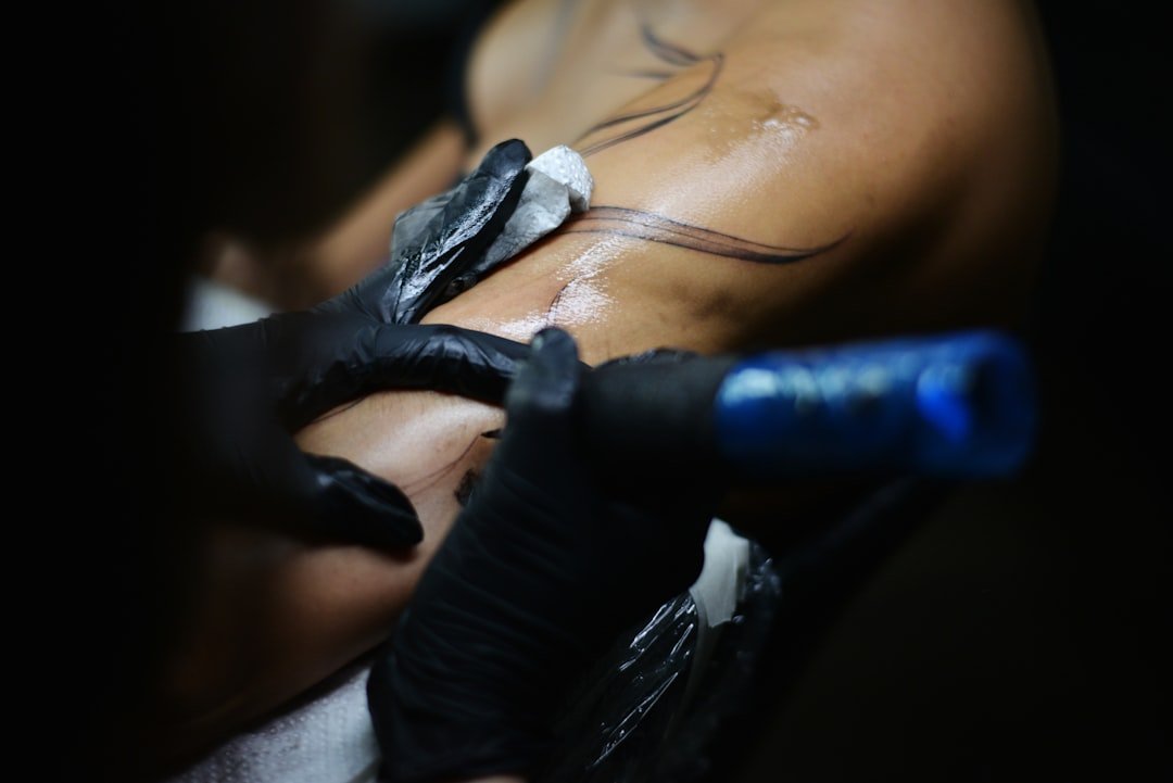 Demonstration of applying thin layers of tattoo aftercare moisturizer